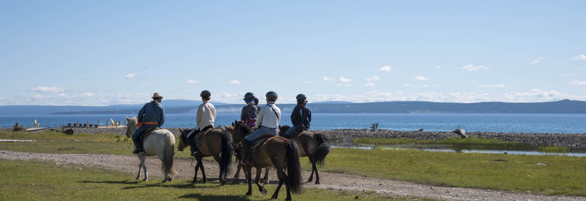 horse riding along the Lake Khuvsgul in Mongolia